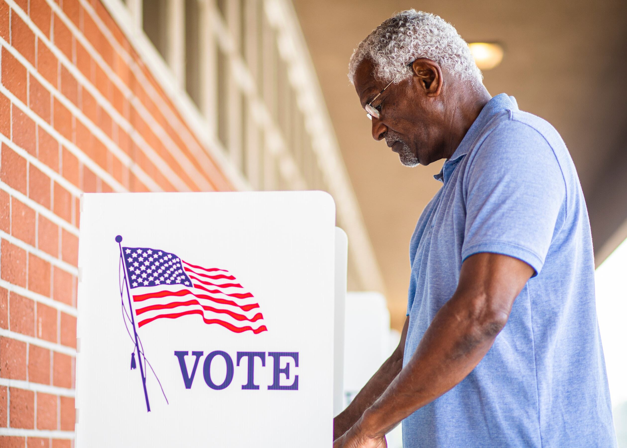 Man casting his vote at a voting station